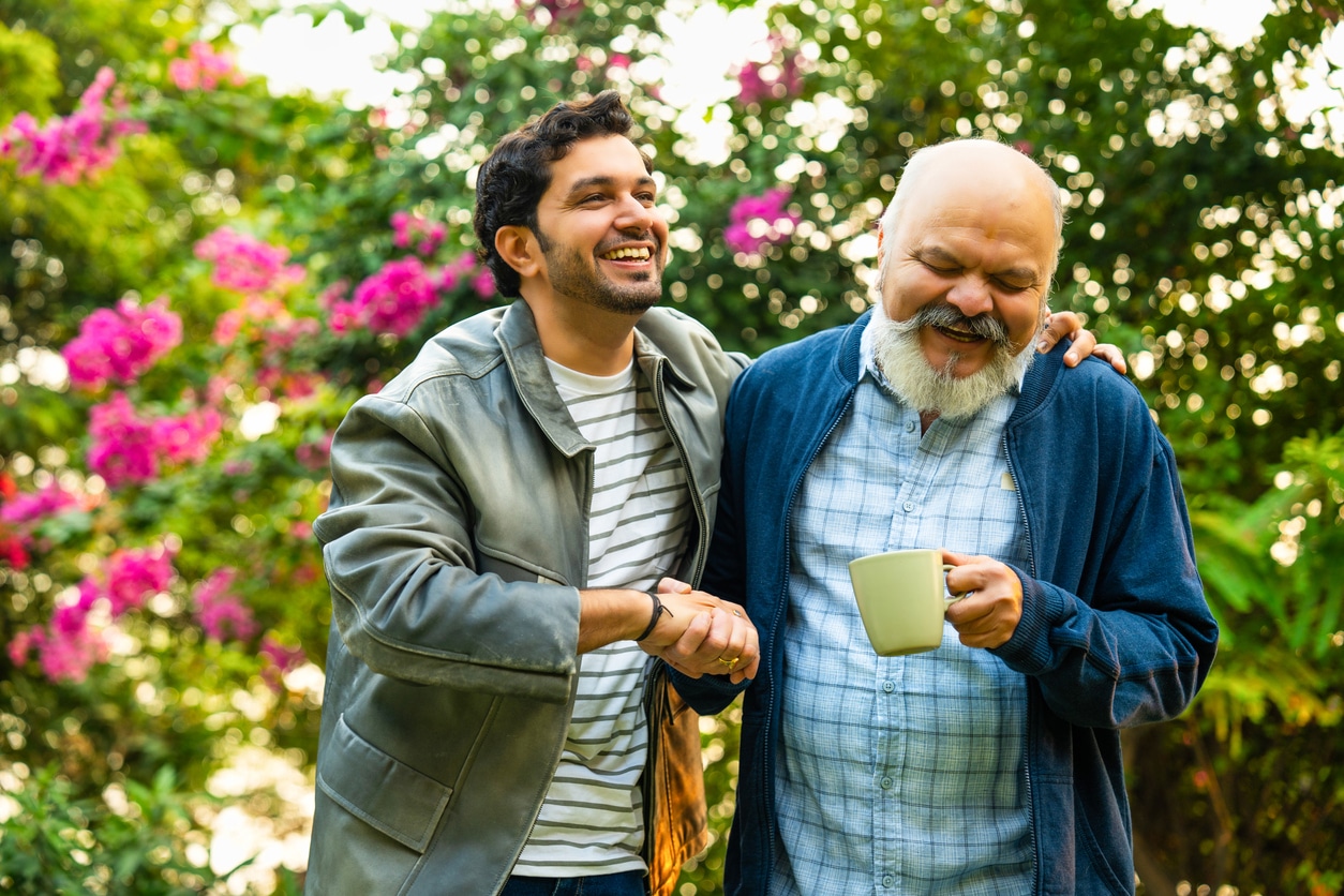 Senior father and son in garden