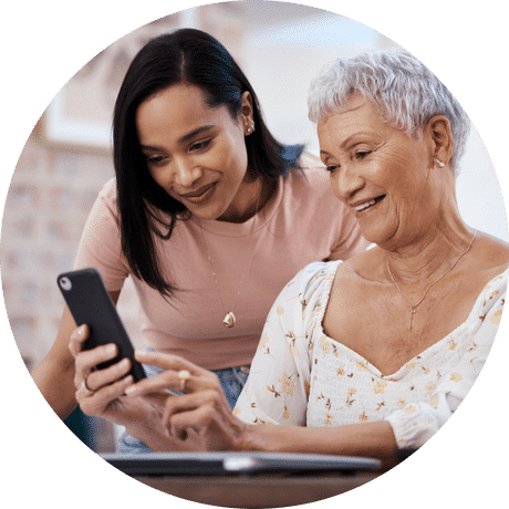 mother and daughter looking at phone